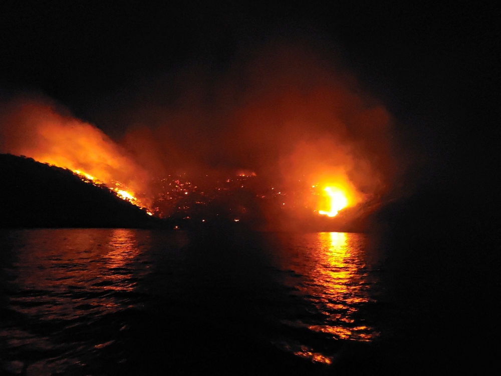 Two crew members of a Greek superyacht were detained today over a forest fire on the picturesque tourist island of Hydra believed to have started by fireworks launched from their vessel. — Reuters pic
