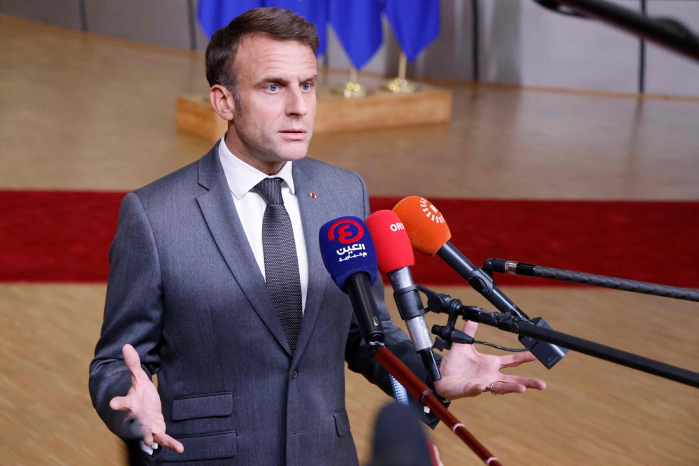 France's President Emmanuel Macron speaks to the press at the end of the European Council Summit at the EU headquarters in Brussels June 28, 2024. — AFP pic
