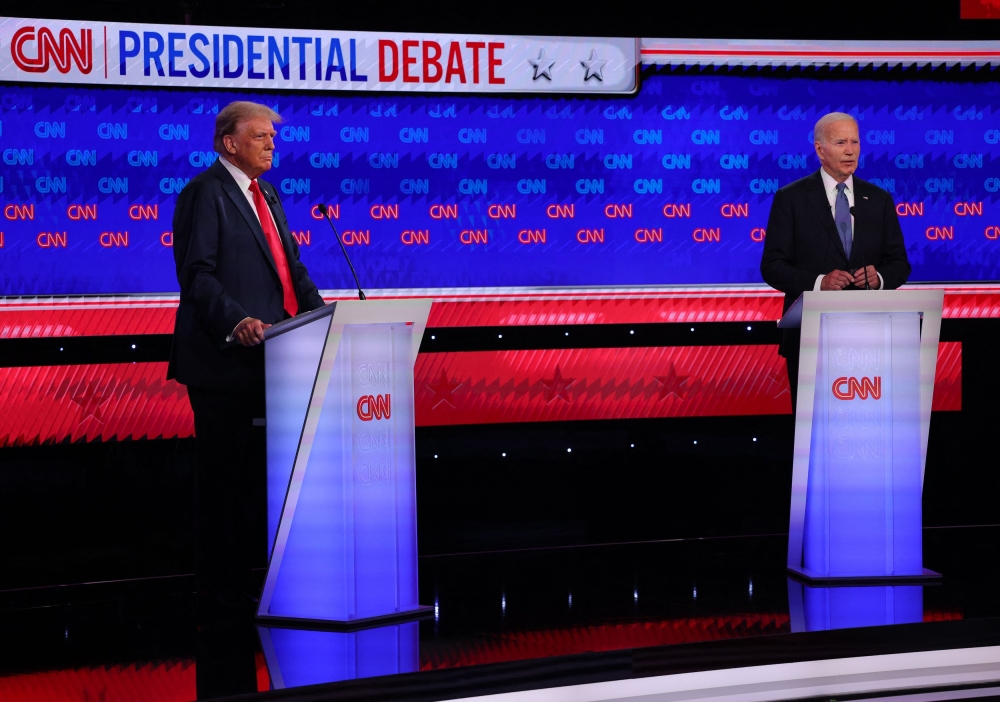Democrat candidate, US President Joe Biden, and Republican candidate, former US President Donald Trump, attend a presidential debate in Atlanta, Georgia June 27, 2024. — Reuters pic