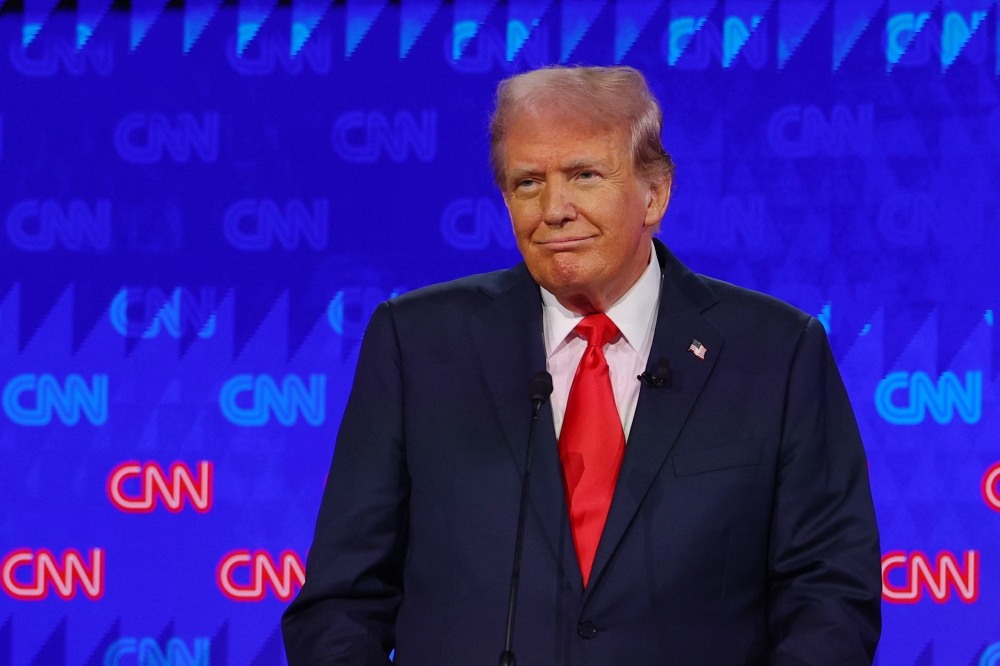 Republican candidate, former US President Donald Trump, attends a presidential debate with Democrat candidate, US President Joe Biden, in Atlanta, Georgia June 27, 2024. — Reuters pic