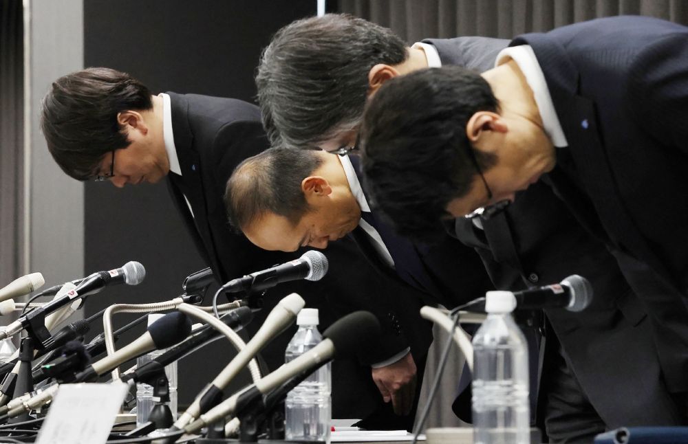 This file photo taken on March 29, 2024 shows Kobayashi Pharmaceutical Co. president Akihiro Kobayashi (2nd from left) apologising after five deaths potentially linked to the the company’s dietary supplements containing red yeast rice. — AFP pic