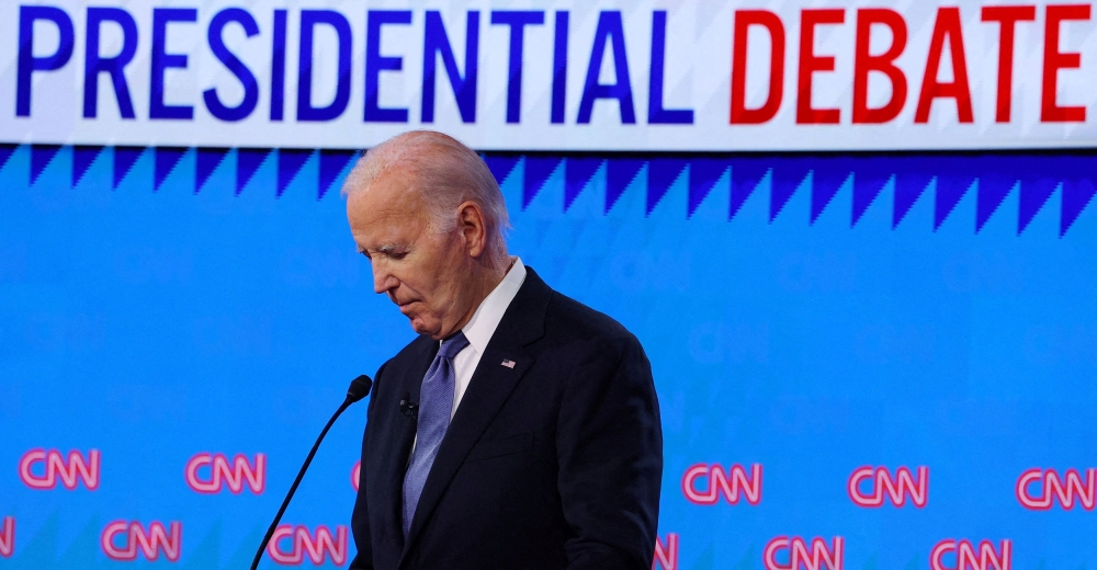 Democrat presidential candidate US President Joe Biden listens as Republican presidential candidate and former US President Donald Trump speaks during their debate in Atlanta June 27, 2024. — Reuters pic