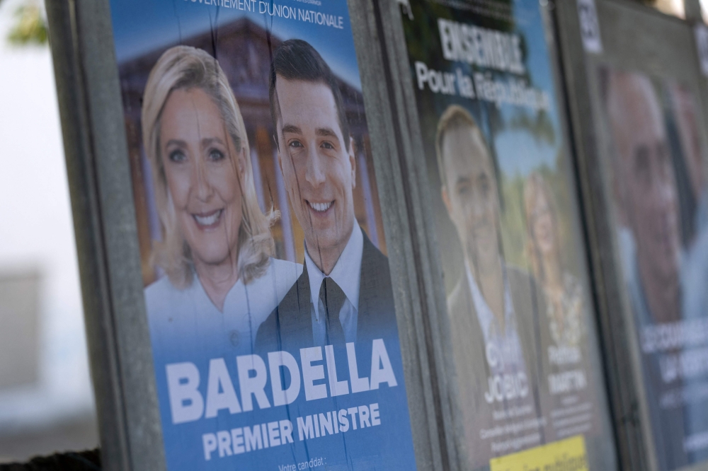 This photograph shows a campaign poster of the French far-right Rassemblement National (RN) party for the upcoming French legislative elections in Callac, western France June 27, 2024. — AFP pic