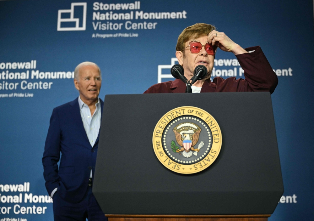 British musician Elton John speaks as US President Joe Biden looks on during the Stonewall National Monument Visitor Centre grand opening ceremony in New York June 28, 2024. — AFP pic