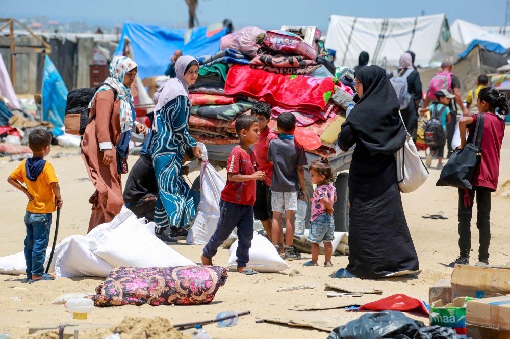Displaced Palestinians evacuate the Mawassi area in southwest Khan Younis in the southern Gaza Strip on June 28, 2024, amid the ongoing conflict between Israel and the militant Hamas group. — AFP pic
