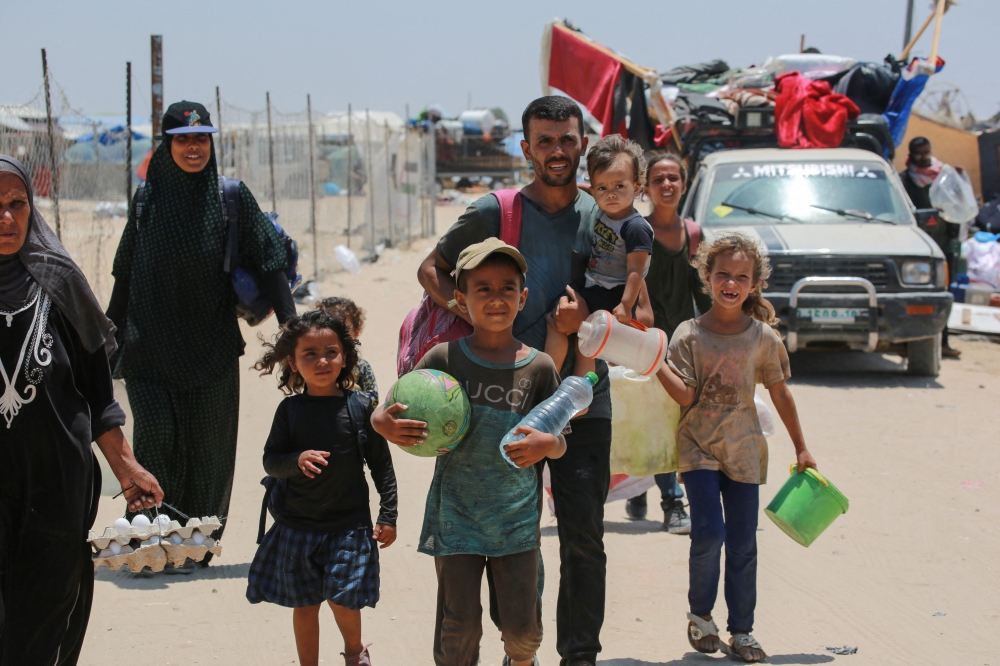 Displaced Palestinians evacuate the Mawassi area in southwest Khan Younis in the southern Gaza Strip on June 28, 2024, amid the ongoing conflict between Israel and the militant Hamas group. — AFP pic