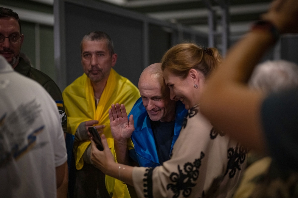 This handout photograph taken and released by the Ukrainian Defence Ministry press service on June 29, 2024, shows Ukrainian citizens who returned from Russian captivity during an exchange of prisoners of war in Kyiv. — AFP pic/Ukrainian Defence Ministry Press Service
