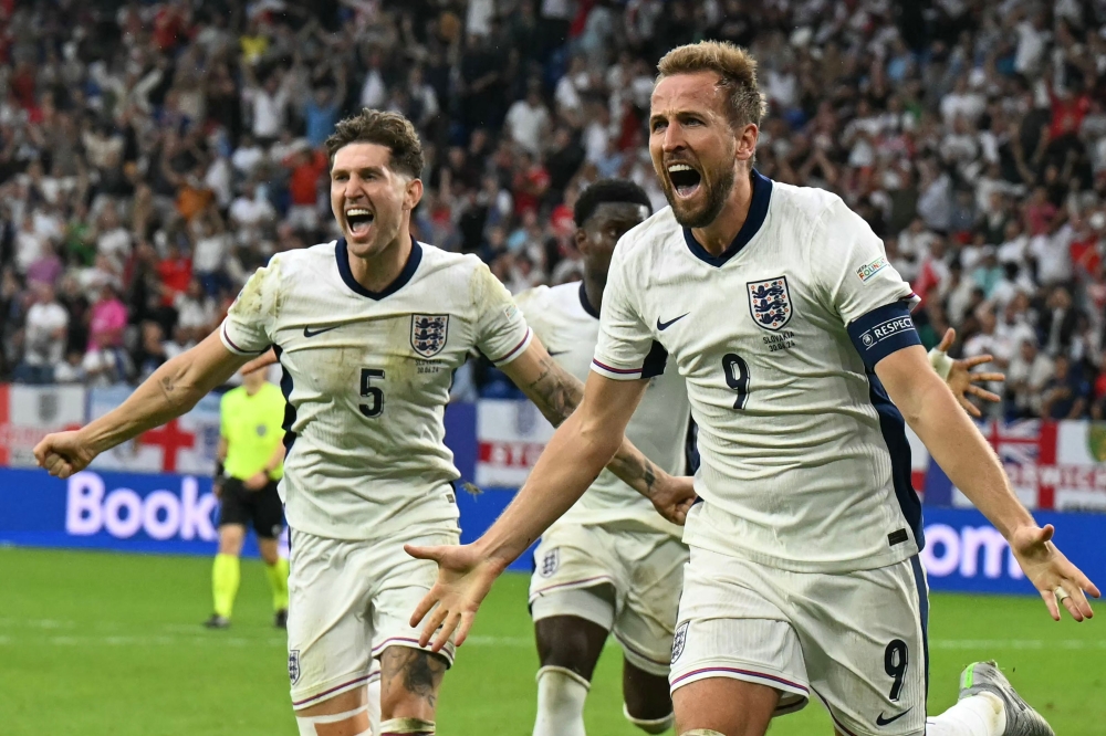 England's forward #09 Harry Kane celebrates after he scored his team's second goal during the Uefa Euro 2024 round of 16 football match between England and Slovakia at the Arena AufSchalke in Gelsenkirchen on June 30, 2024 — AFP pic