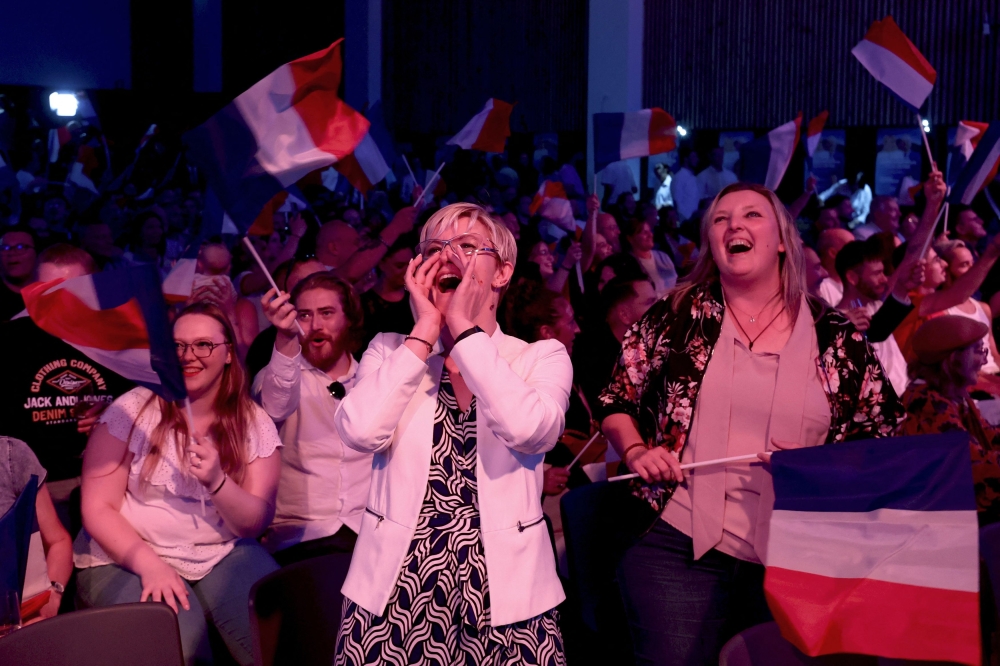 Supporters of the Rassemblement National (National Rally-RN) party after the partial results. — Reuters pic