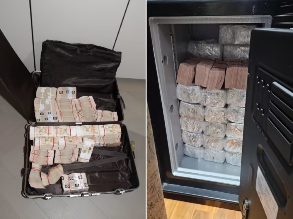 Photos of cash that was seized by the police on Aug 15, 2023. — Picture by Singapore Police Force via TODAY