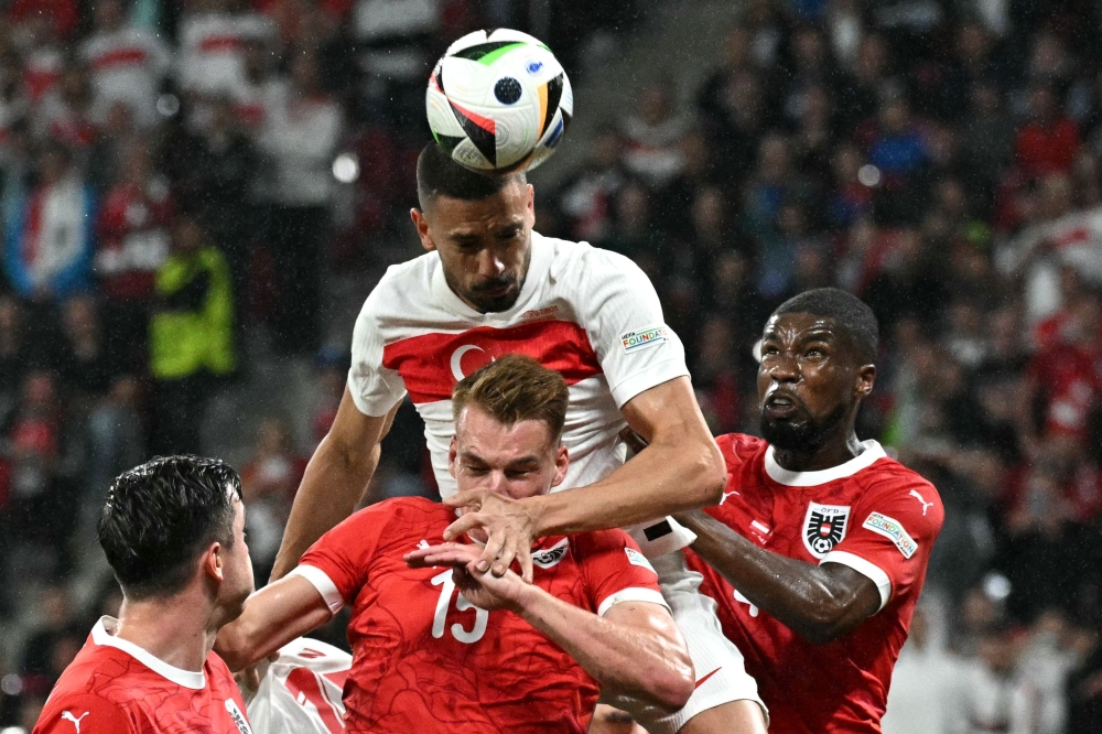 Türkiye’s defender #03 Merih Demiral (centre) heads the ball and scores his team’s second goal during the Uefa Euro 2024 round of 16 football match between Austria and Türkiye. — AFP pic
