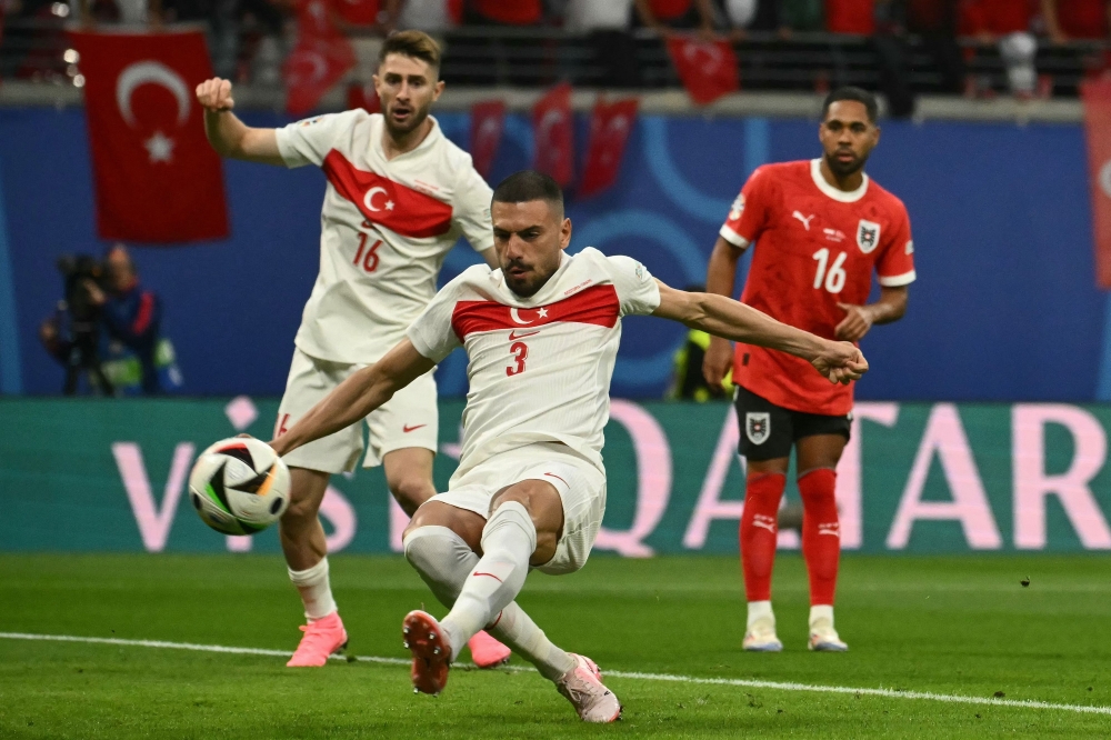 Turkey’s defender Merih Demiral shoots and scores his team’s first goal during the UEFA Euro 2024. — AFP pic