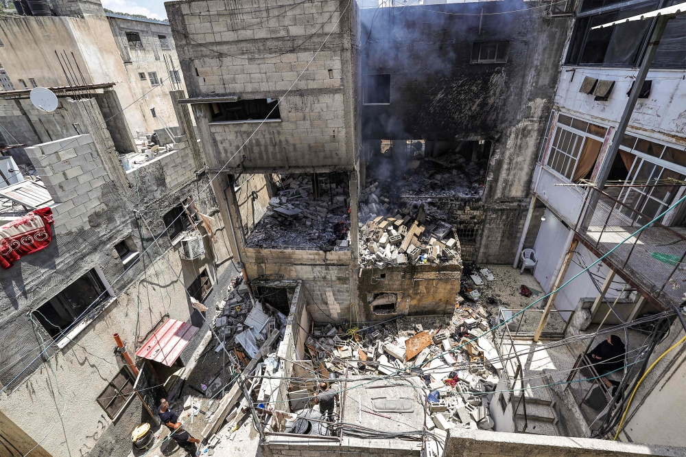 Palestinian official news agency Wafa reported that the dead were young men, aged 22 to 25, killed in a strike by an Israeli drone near the centre of the camp. — AFP pic