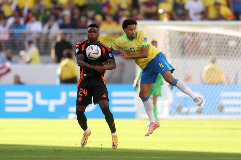 Marquinhos of Brazil defends against Jhon Cordoba of Colombia. — AFP pic