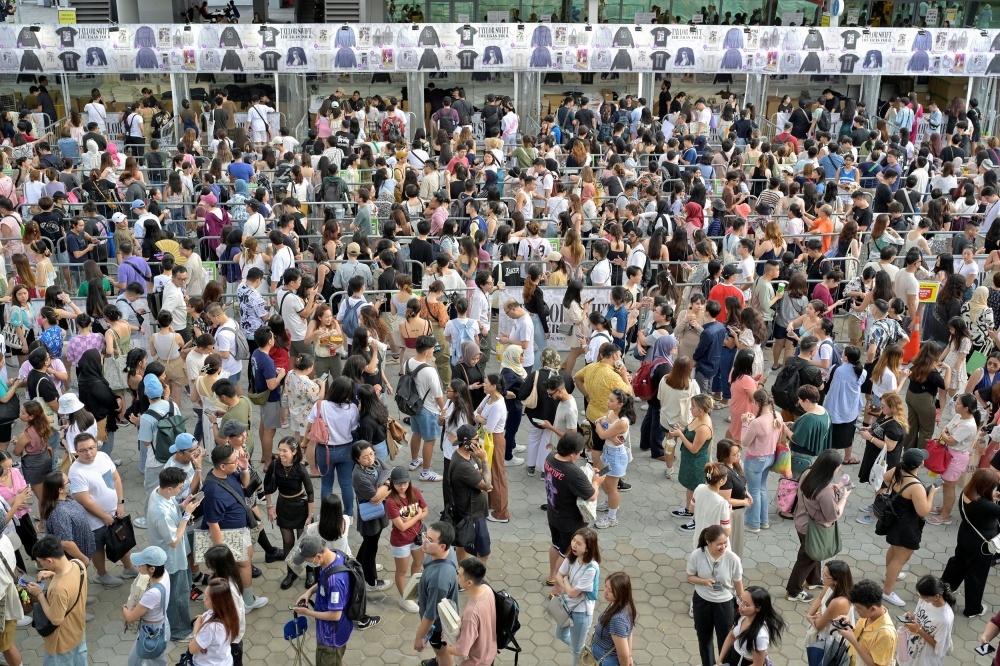 Taylor Swift’s fans, or Swifties, queue to purchase Swift merchandise at the National Stadium during Swift’s Eras Tour concert in Singapore March 2, 2024. — Reuters pic