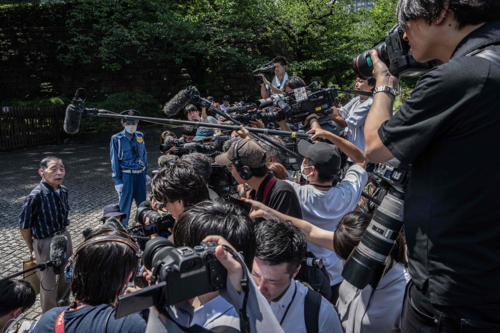 A victim (left) of forced sterilisation under a now-defunct eugenics law, speaks to the media before entering the Supreme Court of Japan in Tokyo on July 3, 2024. — AFP pic
