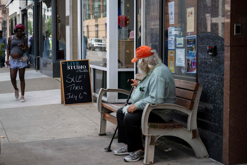 A person sits on a bench in downtown Scranton, Pennsylvania on July 3, 2024. Residents voiced alarm about the US president following his disastrous debate last week against Donald Trump. — AFP pic