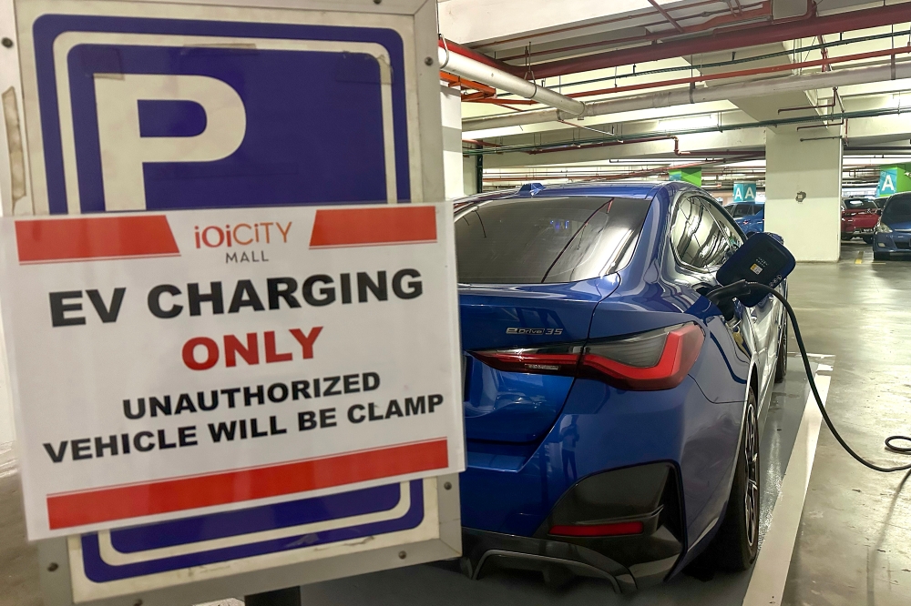 An electrical vehicle is parked at a charging station in Putrajaya in this June 18, 2024 photograph. — Picture by Shafwan Zaidon