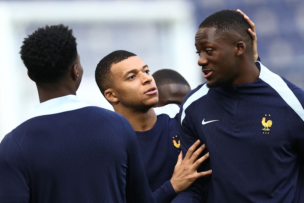 (From L) France's midfielder #08 Aurelien Tchouameni, France's forward #10 Kylian Mbappe and France's defender #24 Ibrahima Konate react during a MD-1 training session at the Volksparkstadion in Hamburg on July 4, 2024, during the UEFA Euro 2024 football championship. — AFP pic