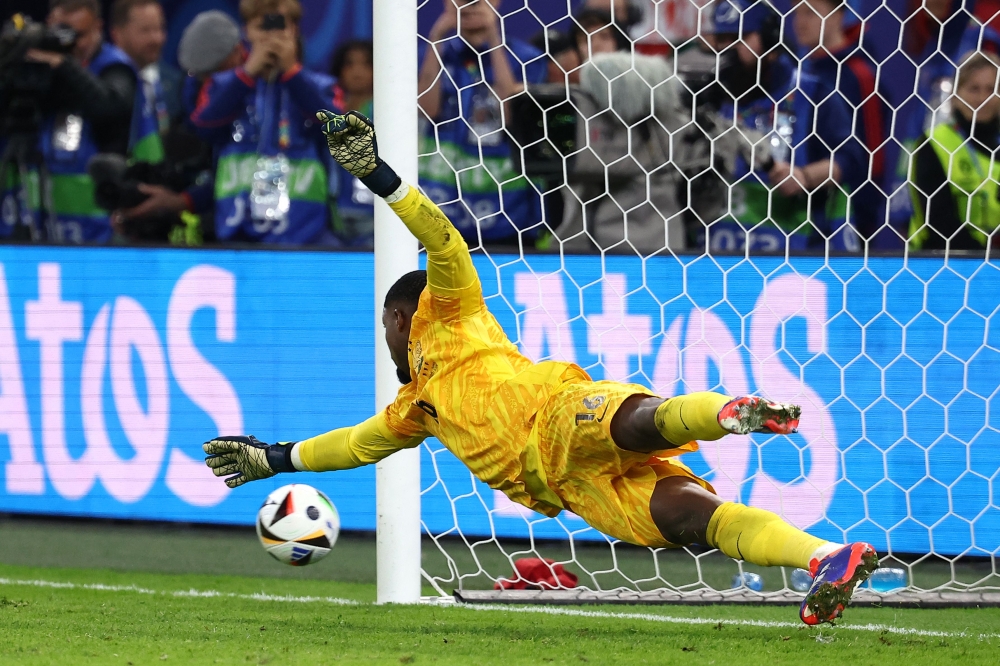 France’s goalkeeper #16 Mike Maignan. — AFP pic