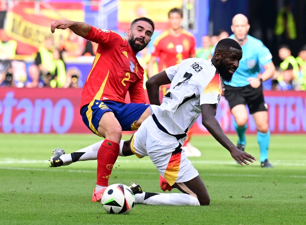 Spain came through a tough physical encounter with Germany and emerged 2-1 winners after extra time yesterday to book a semi-final spot at Euro 2024. — Reuters pic