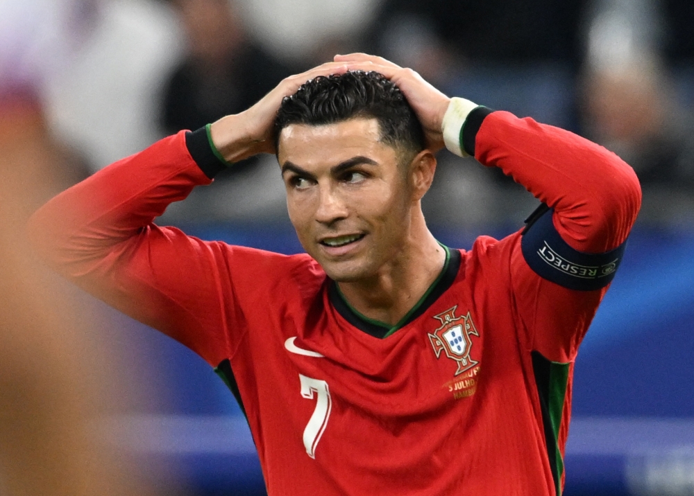 Defeat for Portugal at the European Championship yesterday likely brought down the curtain on the extraordinary international career of Cristiano Ronaldo. — Reuters pic