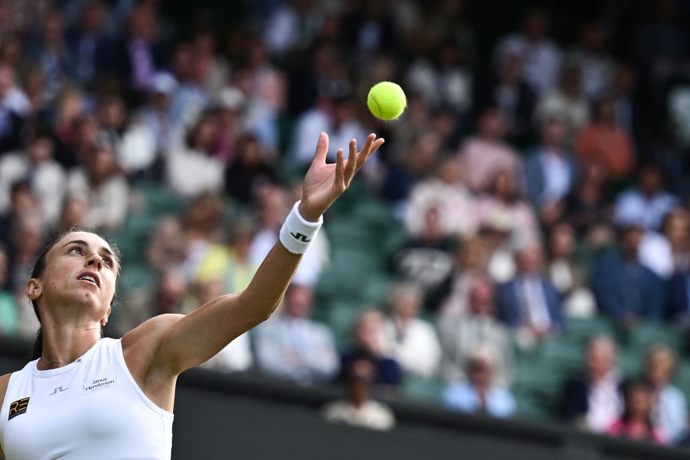 Iga Swiatek is looking ominous on the grass at Wimbledon as she hunts a sixth Grand Slam crown. — AFP pic