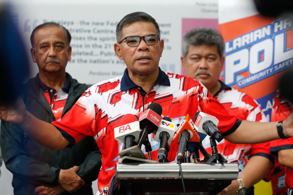 Home Minister Datuk Seri Saifuddin Nasution Ismail speaks to the media at the Community Safety Run in conjunction with the 217th Police Day in Putrajaya, on July 6, 2024. — Picture by Raymond Manuel