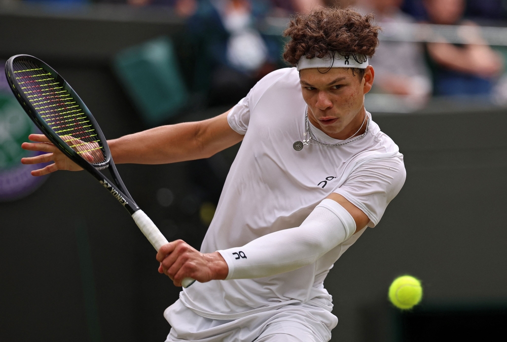 USA's Ben Shelton returns against Canada's Denis Shapovalov during their men's singles tennis match on the sixth day of the 2024 Wimbledon Championships at The All England Lawn Tennis and Croquet Club in Wimbledon July 6, 2024. — AFP pic
