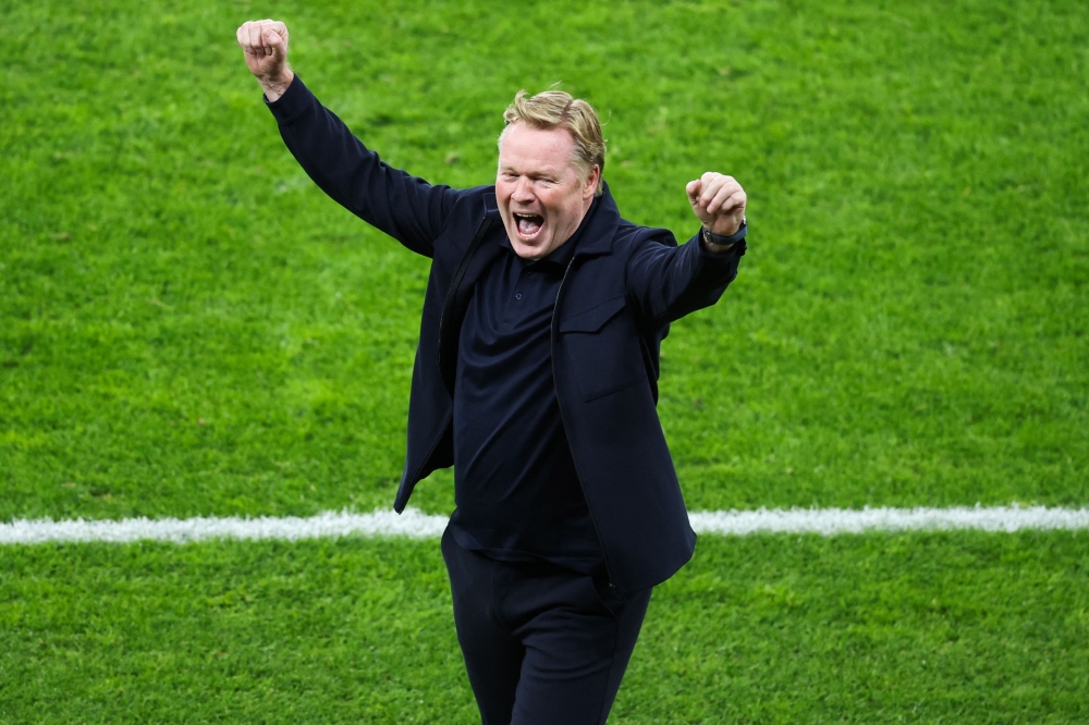 Netherlands’ head coach Ronald Koeman celebrates after the Uefa Euro 2024 quarter-final football match between the Netherlands and Turkey at the Olympiastadion Berlin in Berlin July 6, 2024. — AFP pic