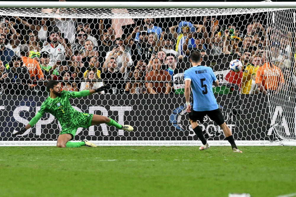 Uruguay’s midfielder #05 Manuel Ugarte scores in a penalty shoot-out to win the Conmebol 2024 Copa America tournament quarter-final football match between Uruguay and Brazil at Allegiant Stadium in Las Vegas, Nevada on July 6, 2024. — AFP pic