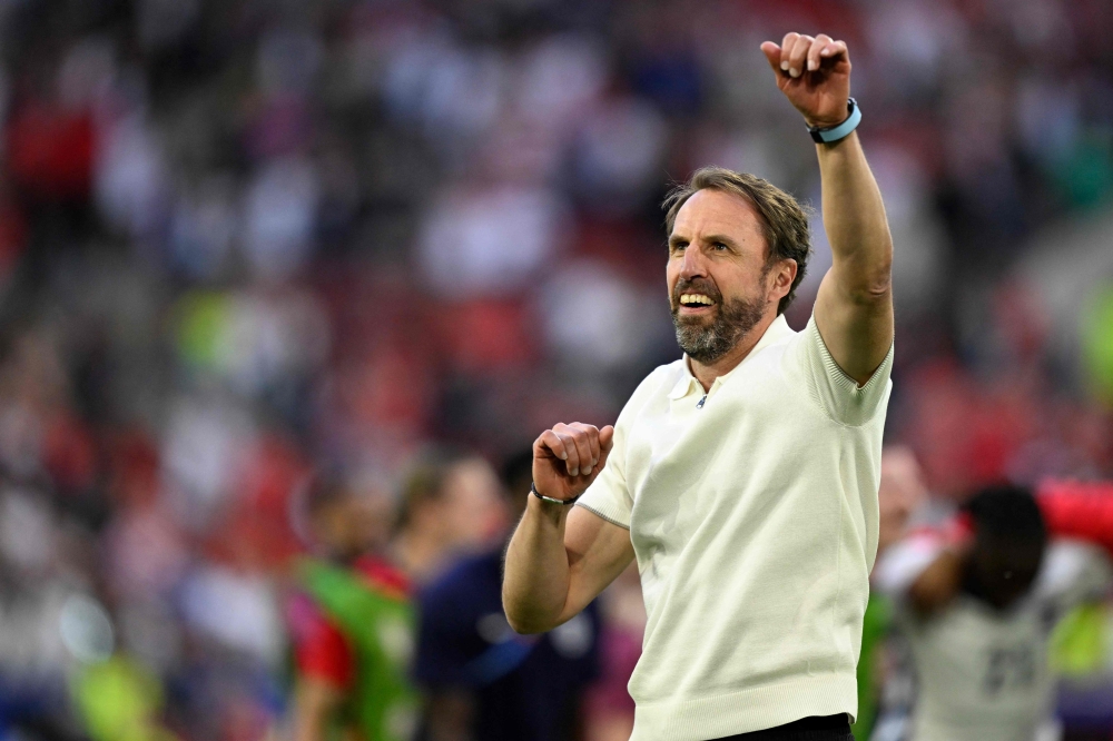 England’s head coach Gareth Southgate celebrates after winning the Uefa Euro 2024 quarter-final football match between England and Switzerland at the Duesseldorf Arena in Duesseldorf July 6, 2024. — AFP pic