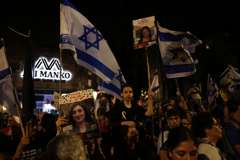 Protesters march to call for the release of Israelis held hostage by Palestinian militants in Gaza since the October attacks, in Jerusalem on July 7, 2024, amid the ongoing conflict in the Gaza Strip between Israel and the Palestinian militant Hamas group. — AFP pic