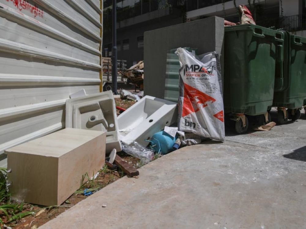 Discarded sinks seen at a dump site at a public housing block of newly built flats in Punggol on July 4, 2024. — Picture by TODAY/Nuria Ling