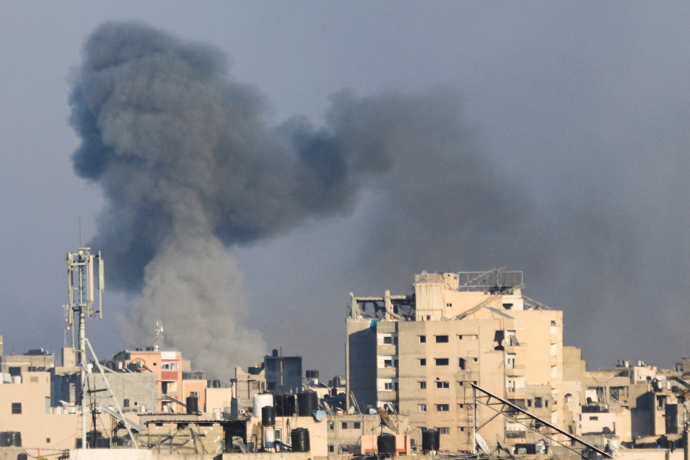 Smoke rises during an Israeli air strike, amid Israel-Hamas conflict, in Gaza City, July 7, 2024. — Reuters pic