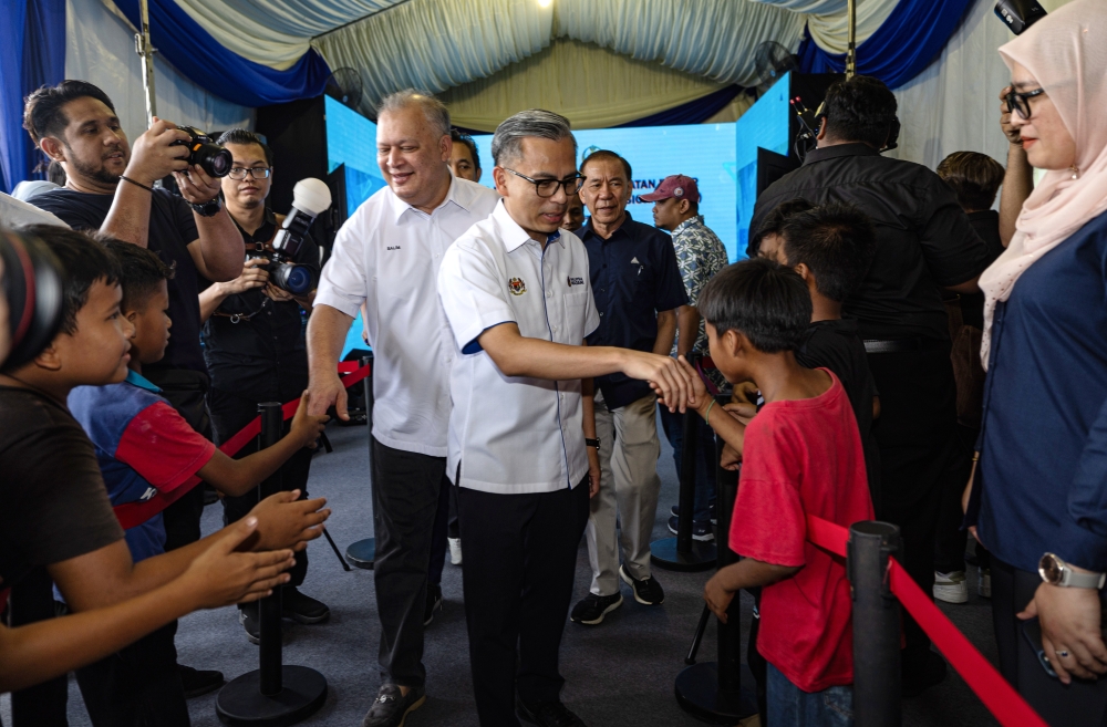 Communications Minister Fahmi Fadzil greets visitors after the launch of the National Information Dissemination Centre (Nadi) in Kg. Dato’ Ahmad Said Manjoi in Ipoh July 8, 2024. — Bernama pic