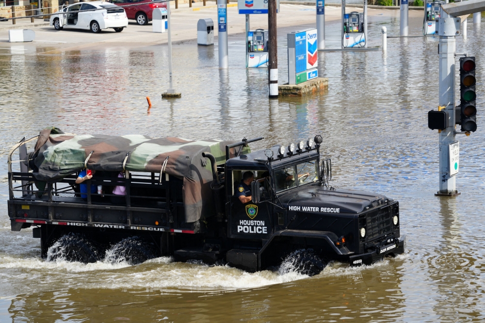 A police rescue vehicle drives through flood waters after Hurricane Beryl passed in Houston July 8, 2024. — Reuters pic