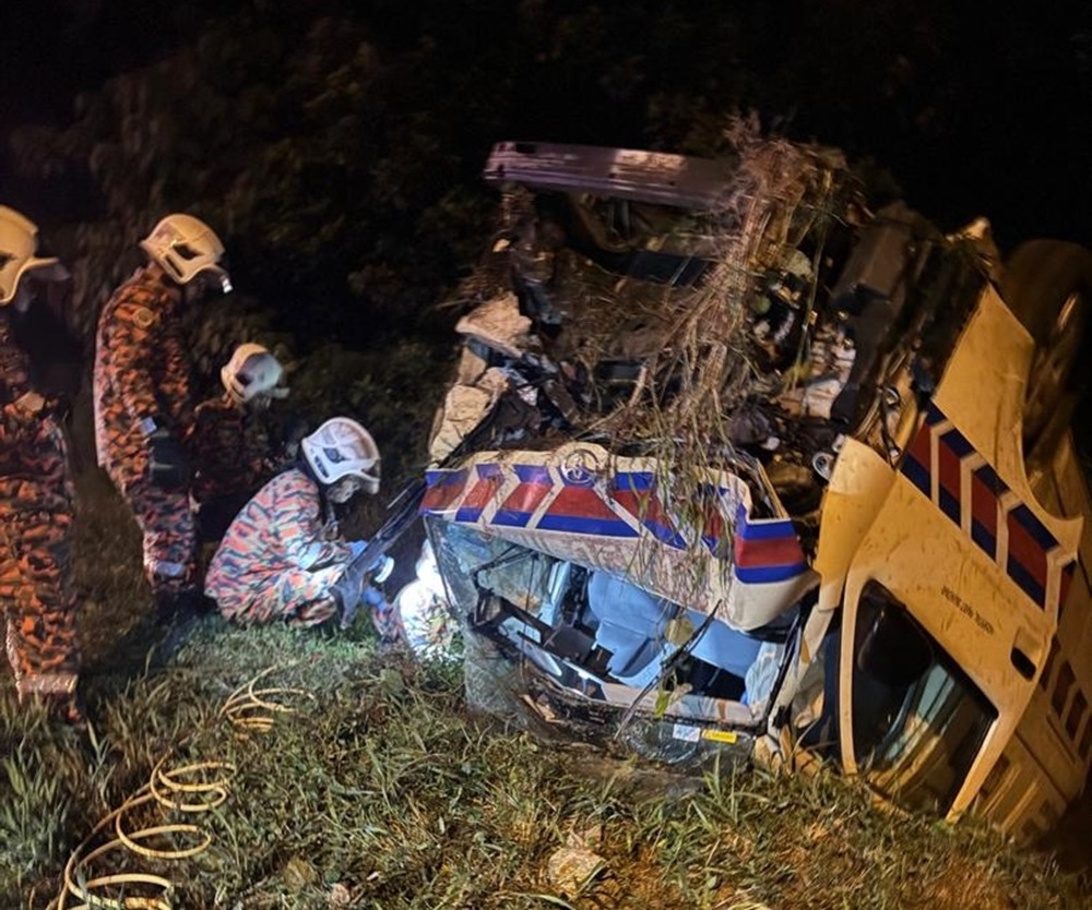 Perak Fire and Rescue Department personnel are seen at the scene where a Health Ministry’s ambulance in skidded into a drain near Jalan Tol Kamunting, Taiping July 9, 2024. — Picture courtesy of Perak Fire and Rescue Department 