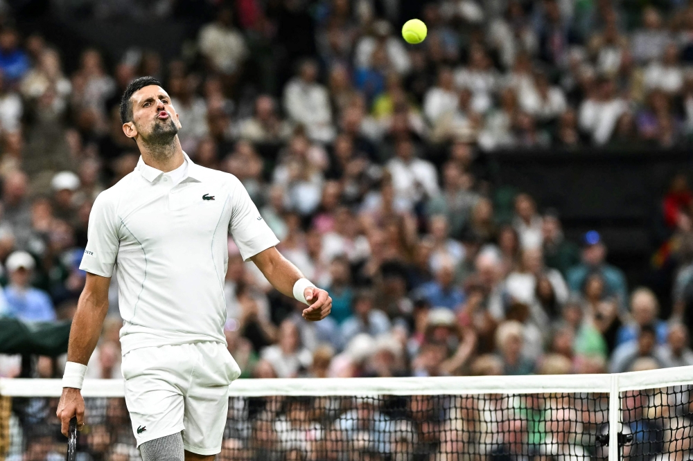 Serbia’s Novak Djokovic celebrates winning the second set against Denmark’s Holger Rune during their men’s singles tennis match on the eighth day of the 2024 Wimbledon Championships at The All England Lawn Tennis and Croquet Club in Wimbledon, on July 8, 2024. — AFP pic 