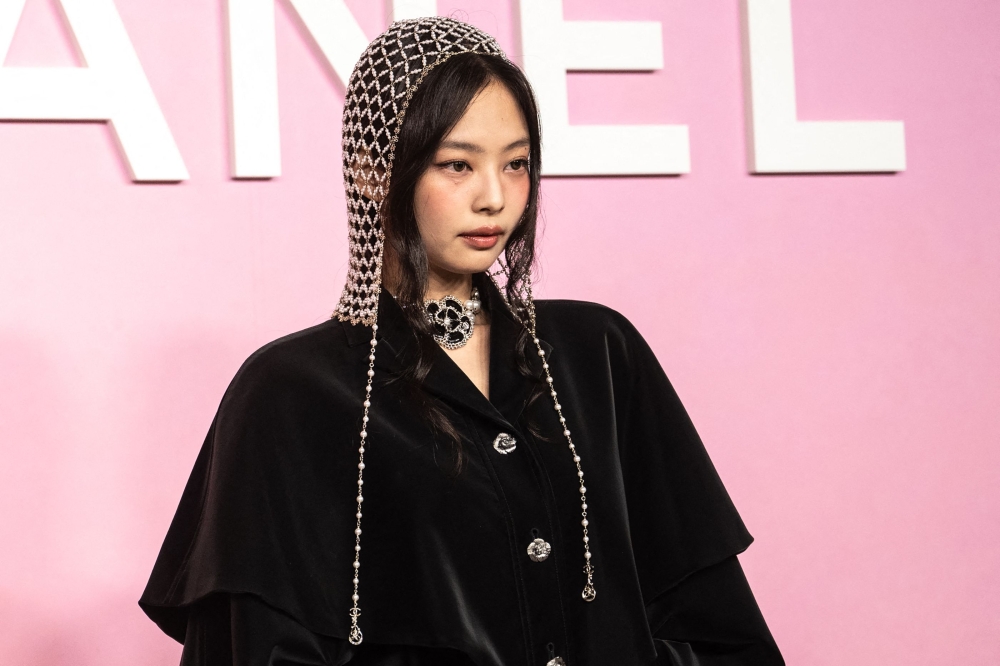 File picture of South Korean K-pop group Blackpink member Jennie Kim taking part in a photo shoot during the 2022/23 Chanel Métiers d’art Dakar Show in Tokyo on June 1, 2023. In the footage, uploaded as part of a live blog on YouTube for fans but subsequently removed even as copies of it spread across the internet, Jennie appears to exhale vape smoke while a bevy of hair and make-up artists work closely on her face. — AFP pic 