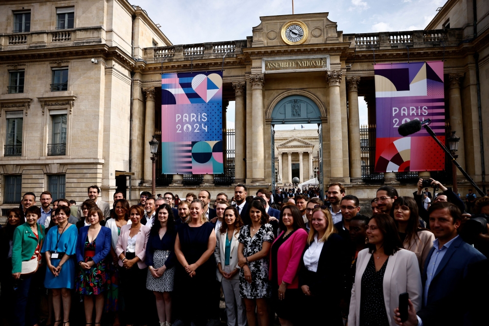 Members of Parliament of the French far-left opposition party La France Insoumise (France Unbowed - LFI) and the alliance of left-wing parties, called the 'Nouveau Front Populaire' (New Popular Front - NFP), pose as they arrive at the National Assembly in Paris after the second round of the early French parliamentary elections, France, July 9, 2024. — Reuters pic