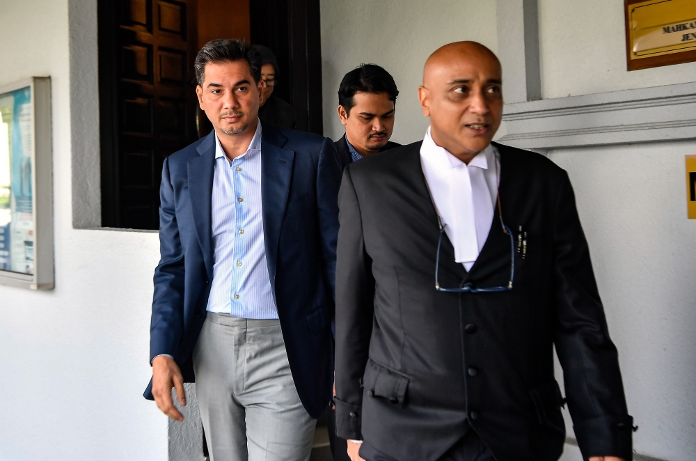 Segambut Bersatu deputy chief Adam Radlan Adam Muhammad (left) at the Kuala Lumpur Sessions Court, July 9, 2024. — Bernama pic 