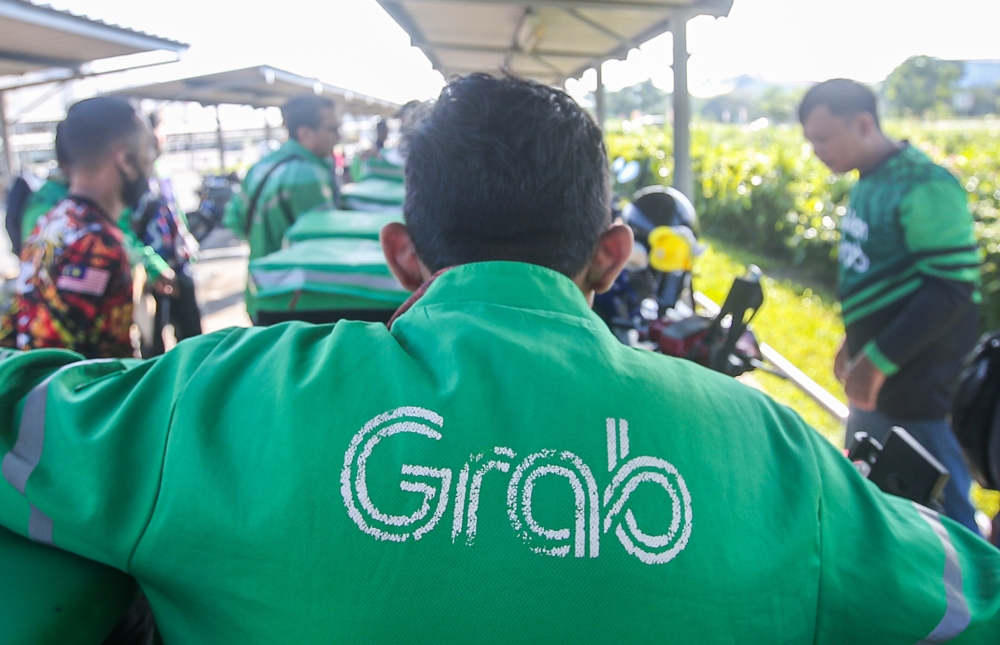 A delivery rider is seen outside the Grab Centre in Aeon, Falim, Ipoh in this January 2024 file photograph. — Picture by Farhan Najib
