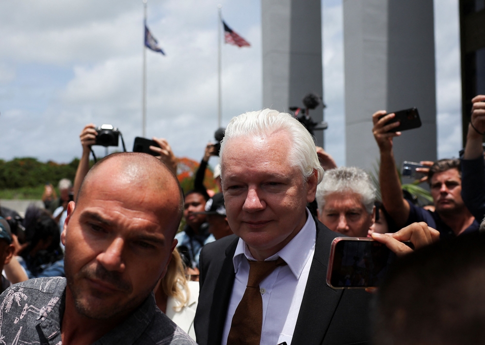 In Julian Assange’s case, things were doubly complicated as the charges against him involved hacking into and publishing government databases i.e. doing illegal stuff. So is whistle-blowing okay if it involves breaking the law? — Reuters pic