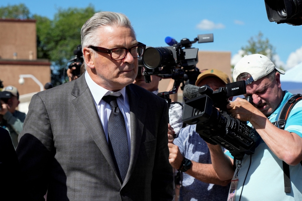 Actor Alec Baldwin walks outside the courthouse, as jury selection begins his manslaughter trial for the 2021 fatal shooting of cinematographer Halyna Hutchins during the filming of the Western movie ‘Rust’, in Santa Fe, New Mexico, July 9, 2024. — Reuters pic 