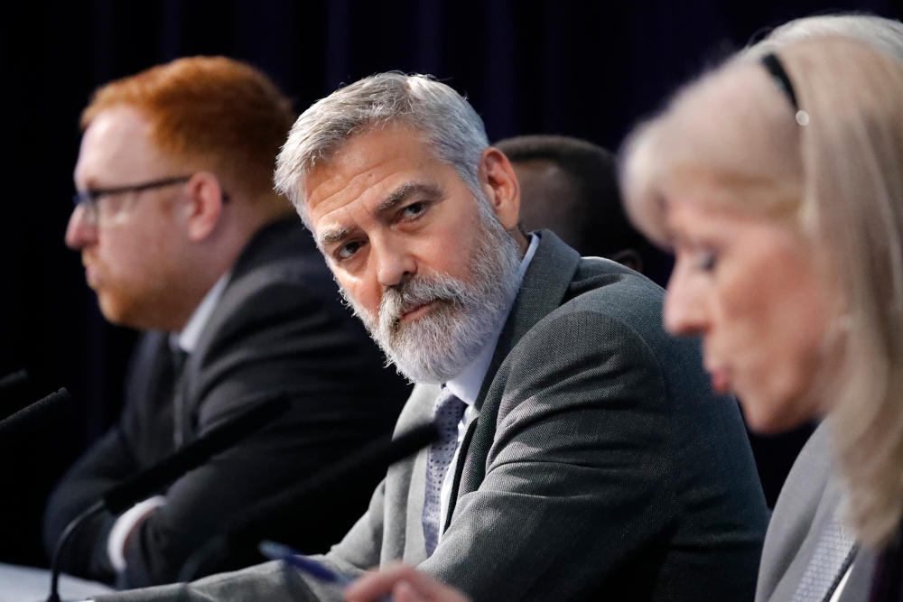This September 2019 file photograph shows US actor George Clooney (centre) at a press conference in London, UK. — AFP pic