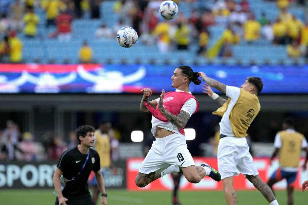 Uruguay's midfielder #15 Federico Valverde (R) and Uruguay's forward #19 Darwin Nunez warm up ahead of the Conmebol 2024 Copa America tournament semi-final football match between Uruguay and Colombia at Bank of America Stadium, in Charlotte, North Caroline on July 10, 2024. — Reuters pic