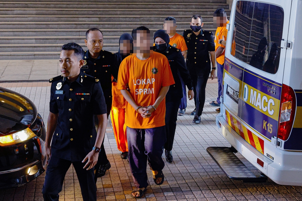 According to a MACC source, the couple was arrested at 6.40pm yesterday, while the other two suspects were arrested at midnight last night after appearing to record statements at the MACC headquarters. — Bernama pic 