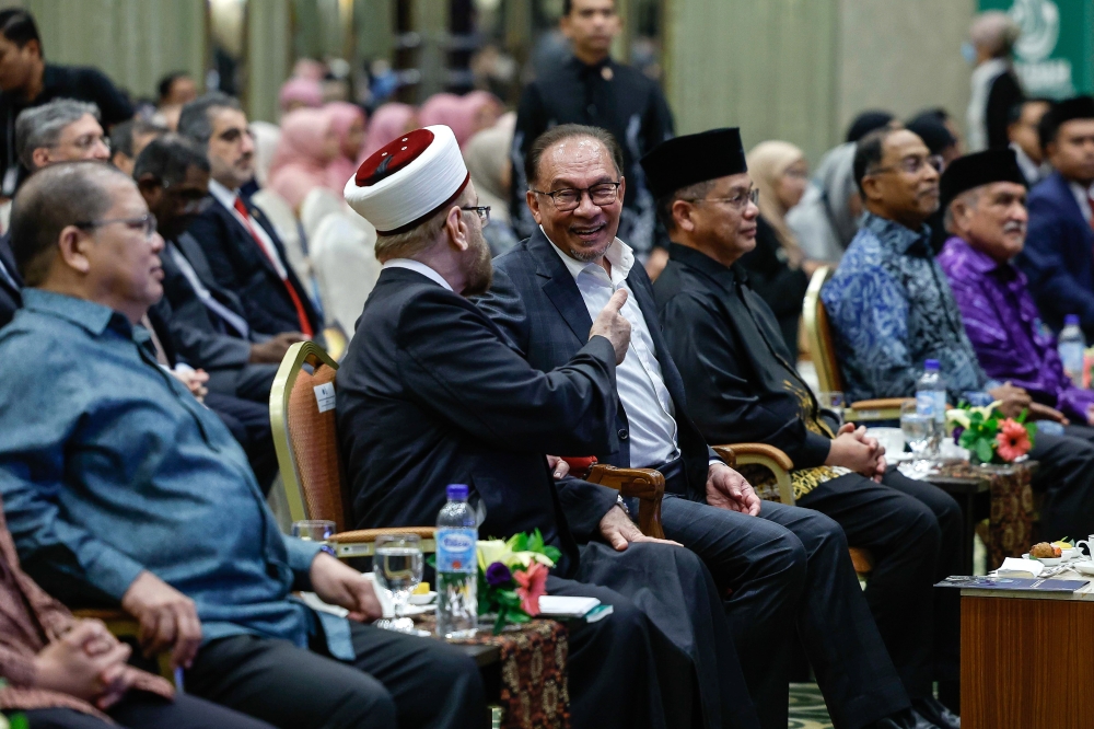 Prime Minister Datuk Seri Anwar Ibrahim with Prof Dr Ali Muhyidddin Ali Al-Qaradaghi at the Global MADANI Forum 2024, July 11, 2024. — Bernama pic