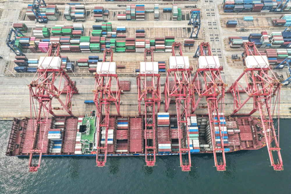 A cargo ship loaded with containers berths at a port in Lianyungang, in eastern China’s Jiangsu province on July 12, 2024. — AFP pic 